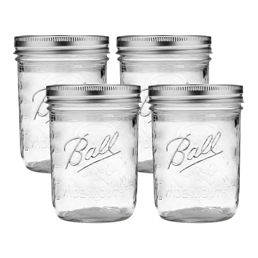 Ball Wide Mouth Glass Mason Jars with Lids and Bands, Used for Canning, Pickling, Juice, Jam, Jelly, Pint Size 16 Ounce (Pack of 4) by BallJar