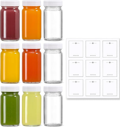 9 Pack 2 oz Glass Shot Bottles w/ White Lids & 9 Labels - Small Clear Jar for Ginger, Wellness Shot, Juice, Sample, Whiskey - Travel Essentials Mini Bottles - Wide Mouth, Leakproof, Dishwasher Safe by MakeLifeBetterEasier