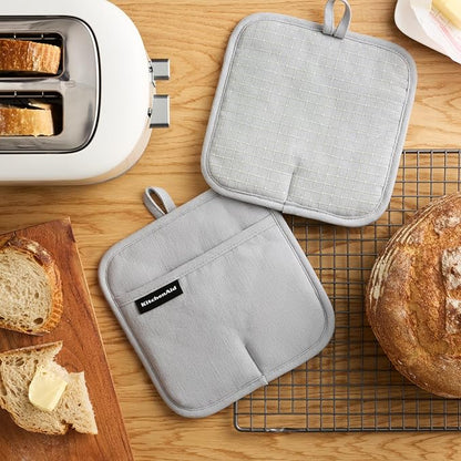 KITCHENAID Gourmet Series Gridlines Pot Holders 2-Pack Set, Heat Resistant up to 600°F, Soft Silicone Grip, Magnetic Cuff, Matte Grey, 8"x8" - Image 2
