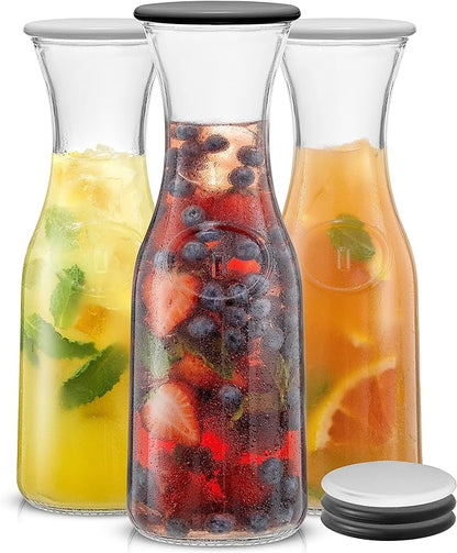 JoyJolt Glass Carafe with Lid, Set of 3 – 1 Liter Glass Pitcher for Mimosa Bar, Water, Iced Tea, Juice, Wine, Lemonade, Milk – Dishwasher Safe Beverage Drink Dispensers for Brunch, Parties by JoyJolt